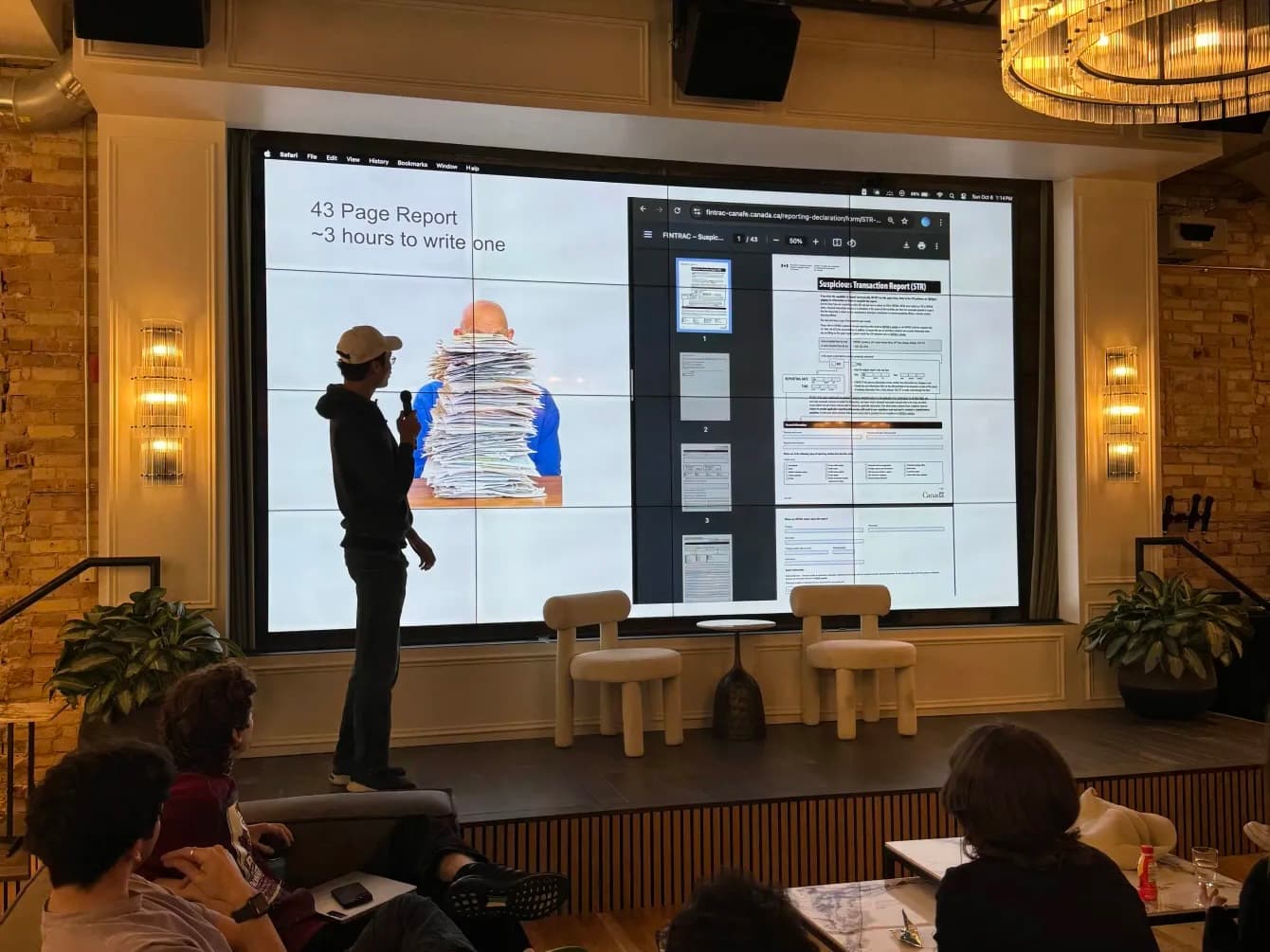 A Quantoflow talk in front of a screen showing a 43-page FINTRAC suspicious transaction report beside the words 43 Page Report, roughly 3 hours to write one